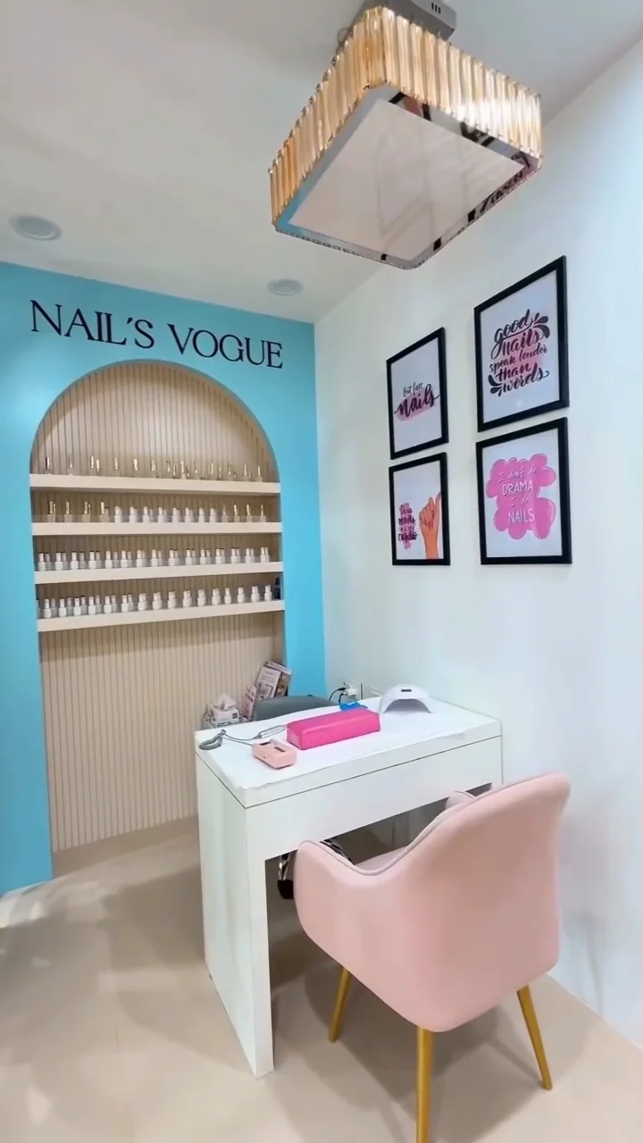 The Nails Vogue station inside Studio99, with a manicure table, pink chair and nail colour display.